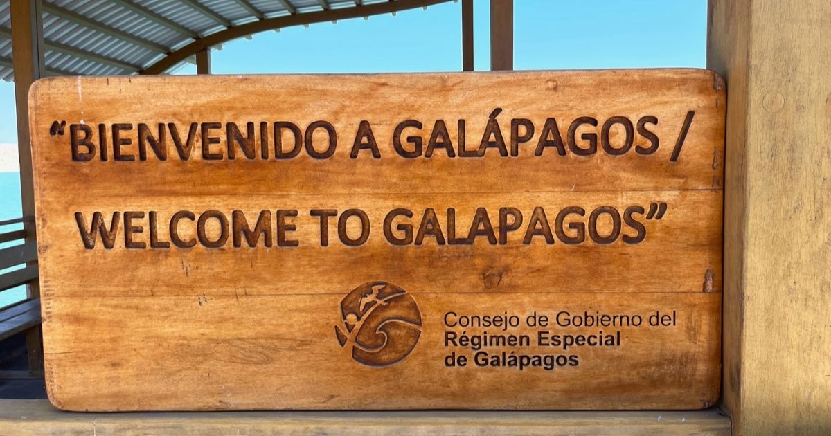 A wooden sign welcoming visitors to the Galapagos Islands
